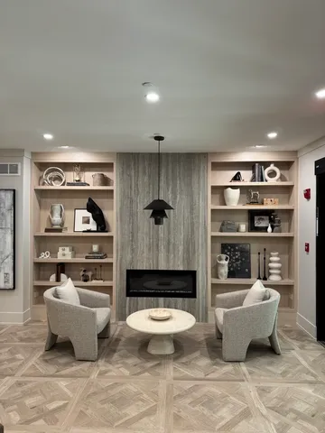a living room with furniture and a rug