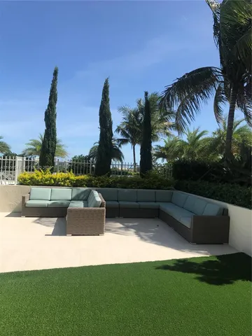 a view of swimming pool and outdoor seating