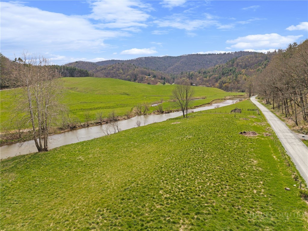 2345 Watauga River Road Sugar Grove, NC 28679 - Photo 4 of 50 a view of an aerial view of residential houses with outdoor space and a lake view
