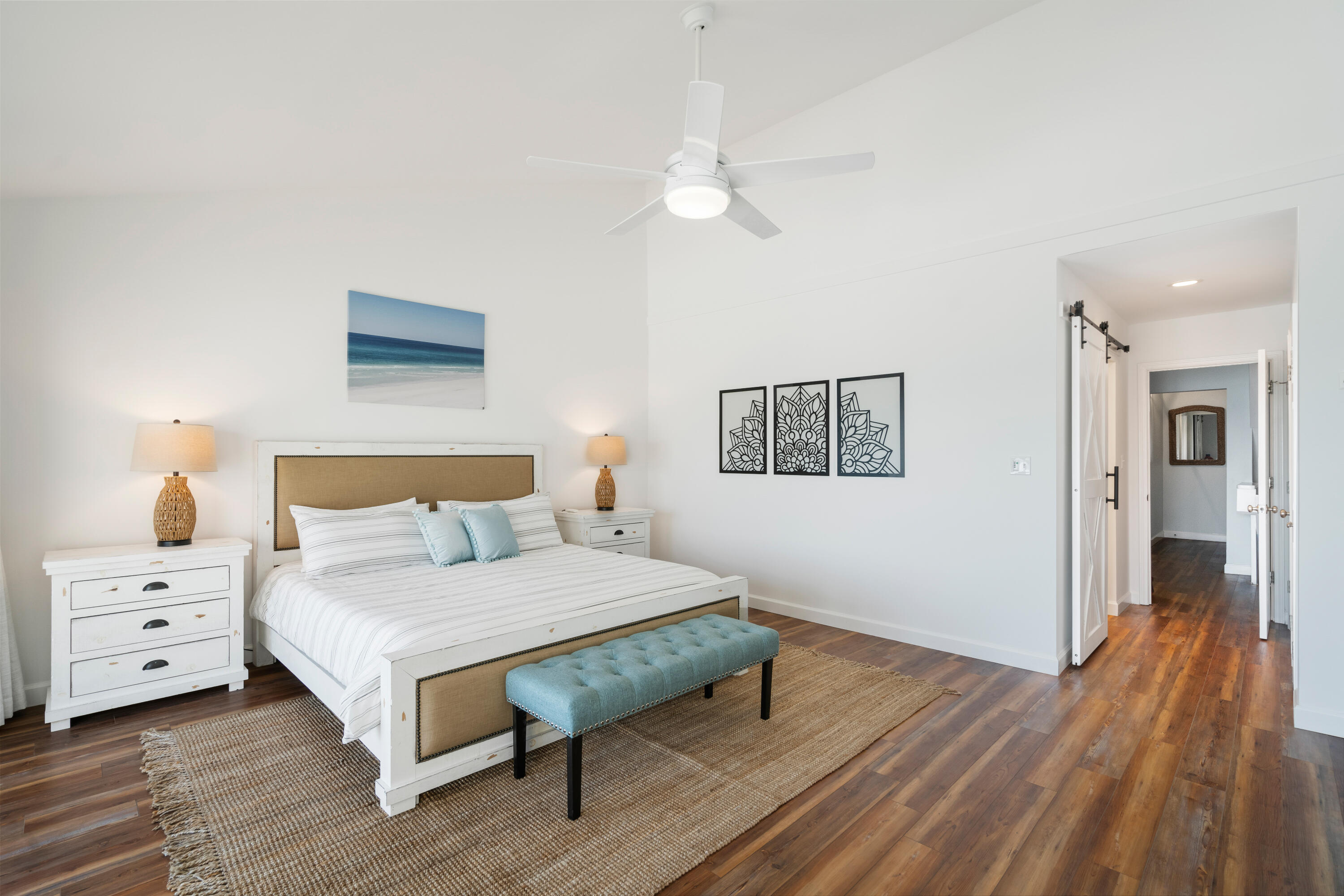 214 Blue Mountain Road, Unit 121 Santa Rosa Beach, FL 32459 - Photo 22 of 39 a bedroom with a bed and a night stand