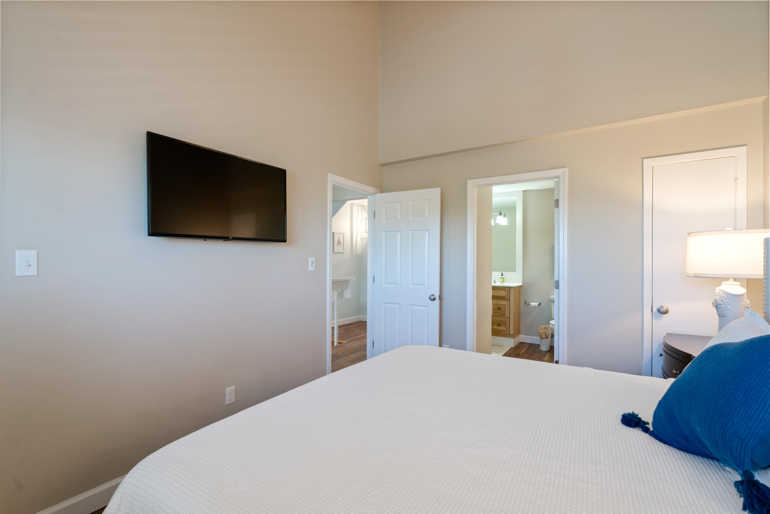 214 Blue Mountain Road, Unit 121 Santa Rosa Beach, FL 32459 - Photo 27 of 39 a bedroom with a bed and a flat screen tv