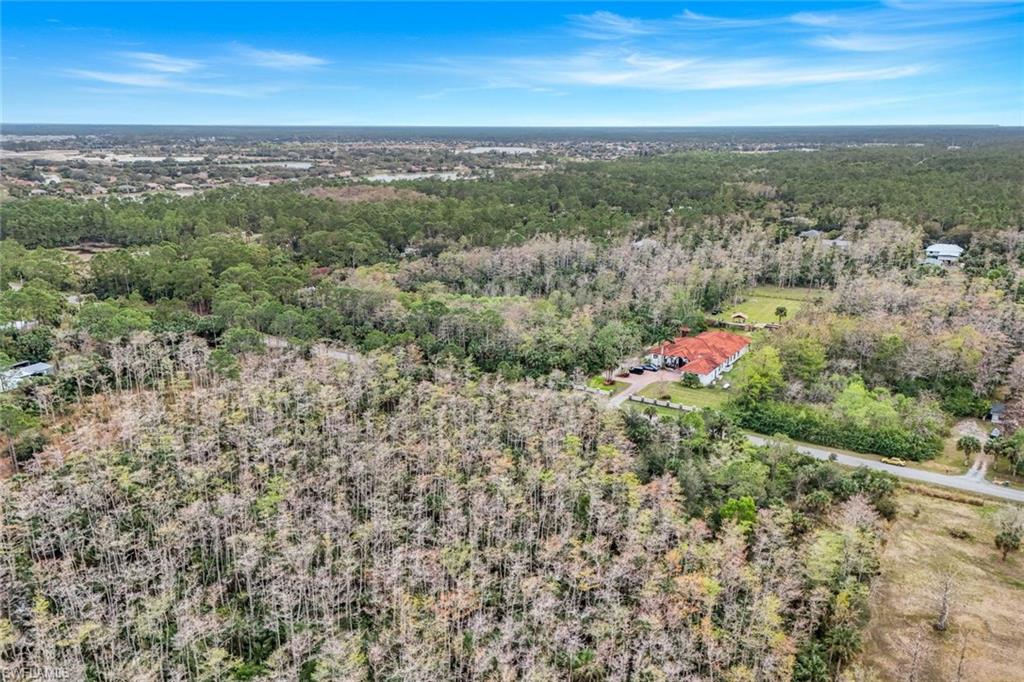 37th Avenue Northeast Naples, FL 34120 - Photo 2 of 7 an aerial view of residential houses with outdoor space
