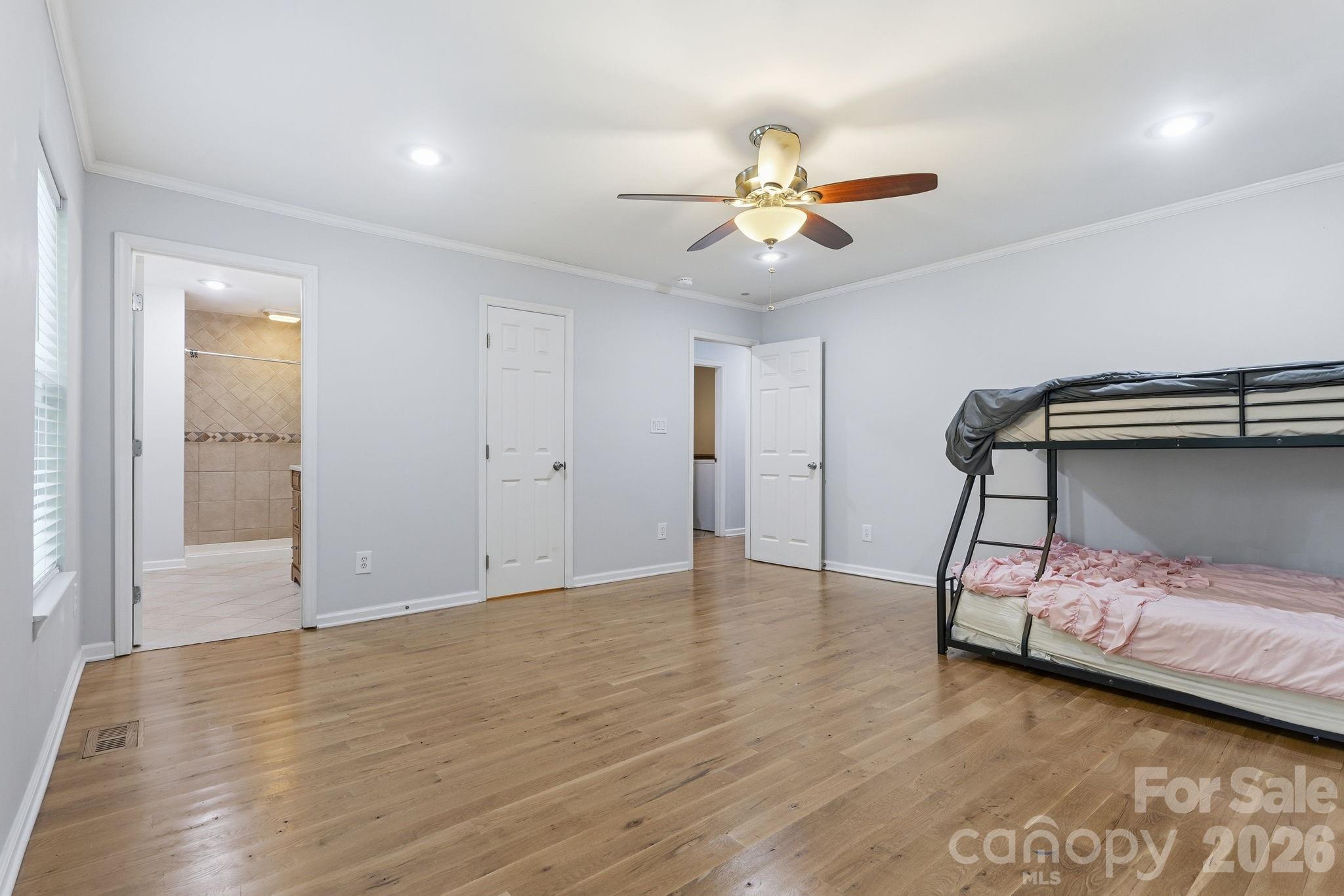 5347 Haney Road York, SC 29745 - Photo 21 of 39 a view of an empty room with wooden floor and a ceiling fan