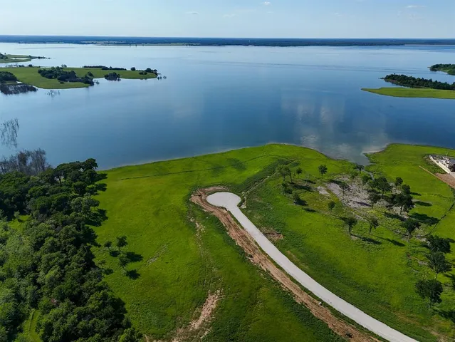 a view of a lake with a yard