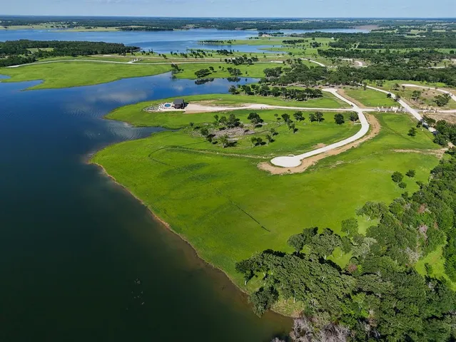 a view of a golf course with a lake view