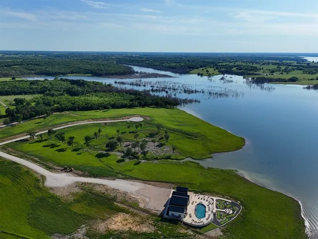 a view of a lake with a yard