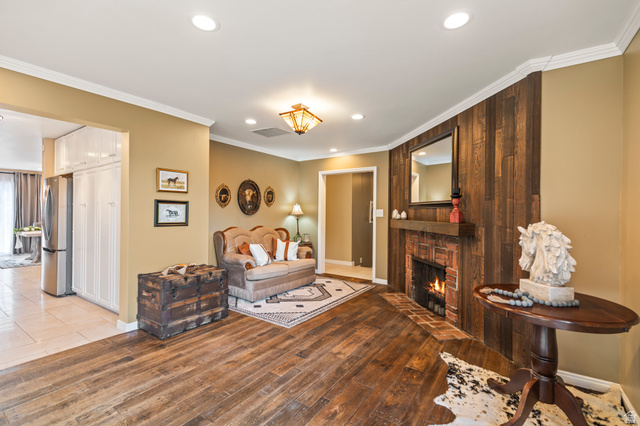 460 Omni Point Road Central Valley, UT 84754 - Photo 22 of 101 Living area featuring a brick fireplace with wood mantel, recessed lighting, and3/4 inch hardwood oak flooring