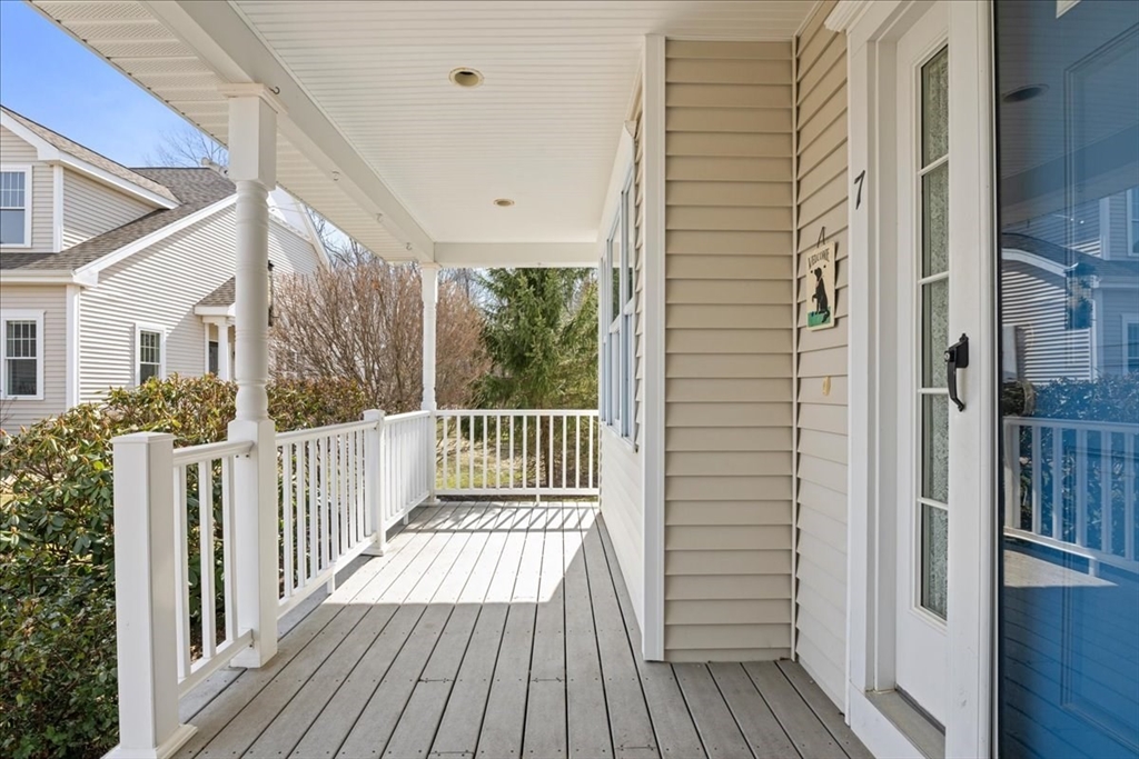 7 Primmett Lane, Unit 7 Worcester, MA 01609 - Photo 37 of 38 a view of a balcony with wooden floor