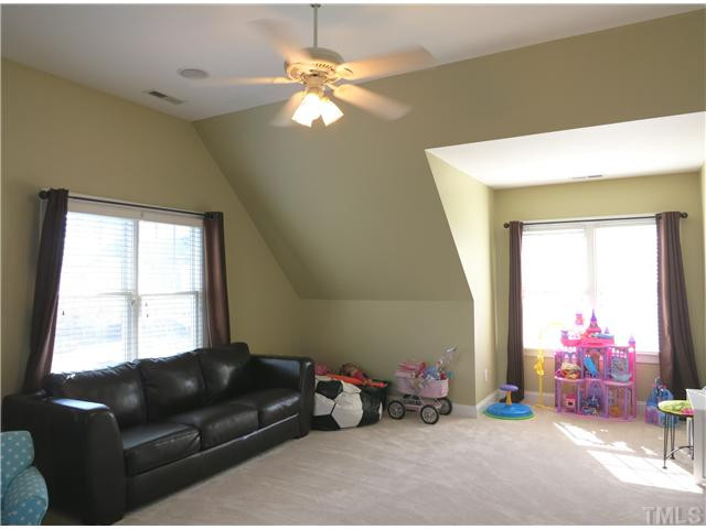 10805 Sagehurst Place Raleigh, NC 27614 - Photo 13 of 25 Upstairs is the spacious vaulted Bonus Rm w/neutral carpet, CF, lots of windows & closet. Bonus Room