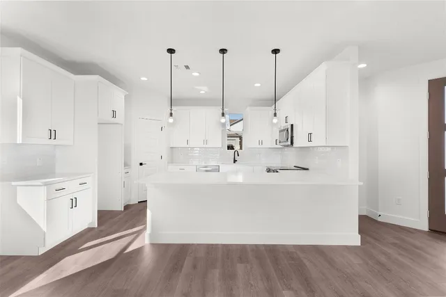 a bathroom with a sink toilet and mirror