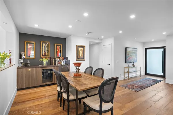a view of a dining room with furniture and window