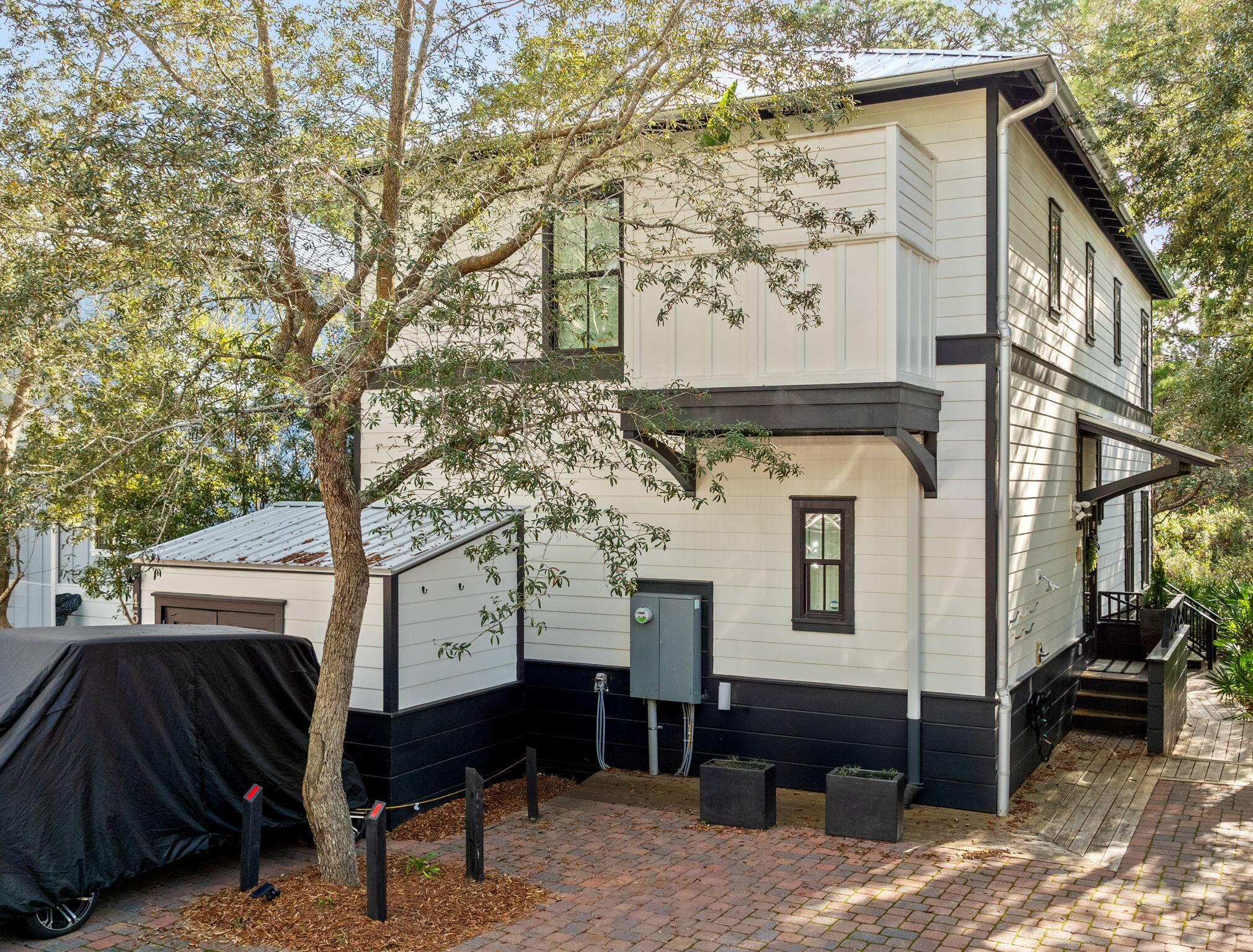 a front view of a house with a garden
