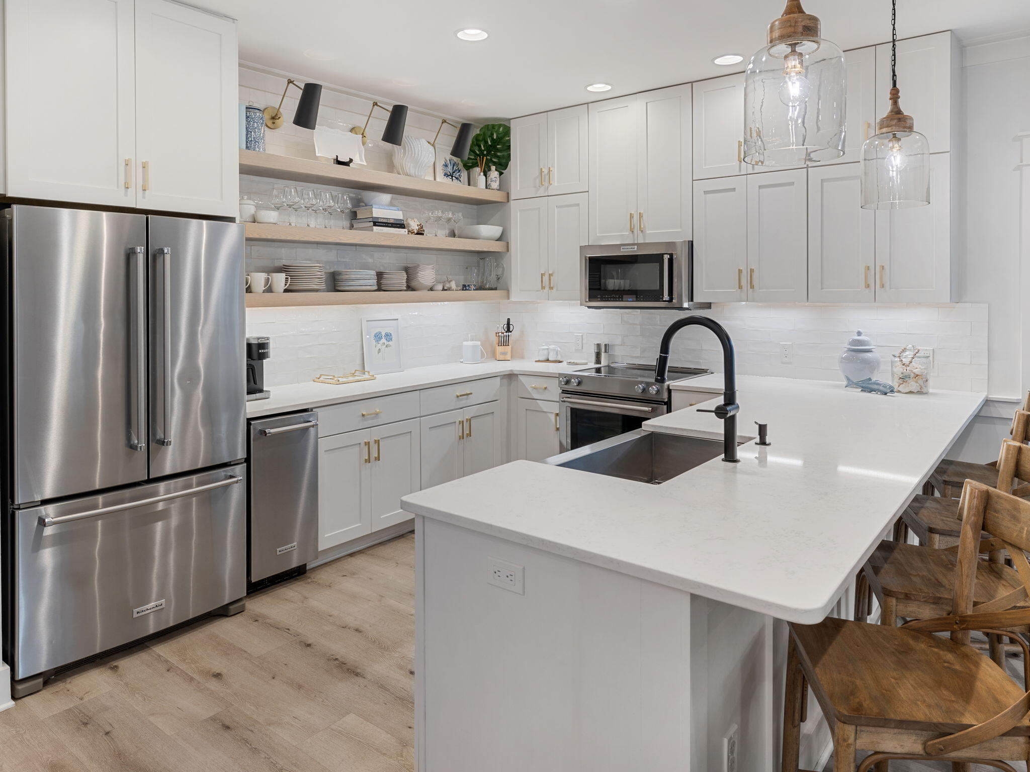 45 Canopy Ln Inlet Beach Inlet Beach, FL 32461 - Photo 3 of 11 a kitchen with white cabinets stainless steel appliances and wooden floor