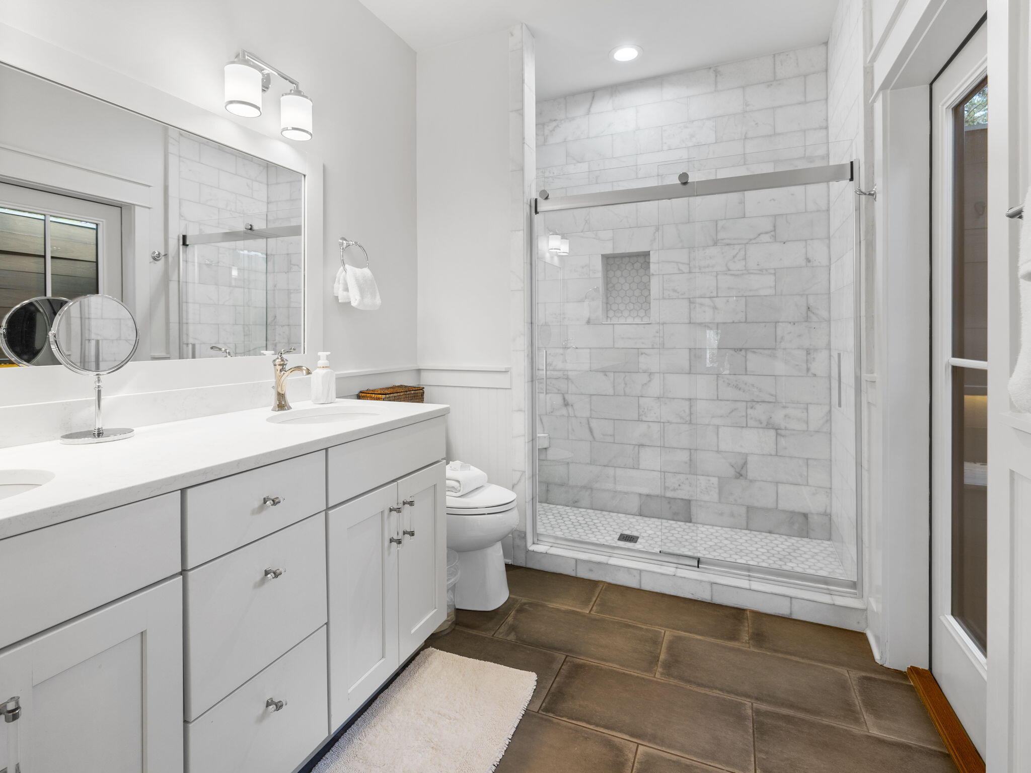 45 Canopy Ln Inlet Beach Inlet Beach, FL 32461 - Photo 6 of 11 a spacious bathroom with a shower sink mirror and toilet