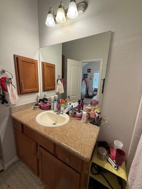 2513 South 2nd Street, Unit 3 Waco, TX 76706 - Photo 26 of 35 a bathroom with a sink a vanity and a mirror