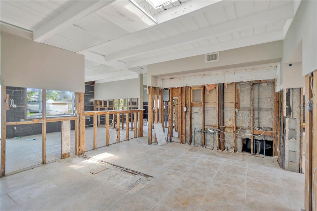 16214 3rd Street East Redington Beach, FL 33708 - Photo 13 of 30 a view of an empty room with floor to ceiling window and stairs