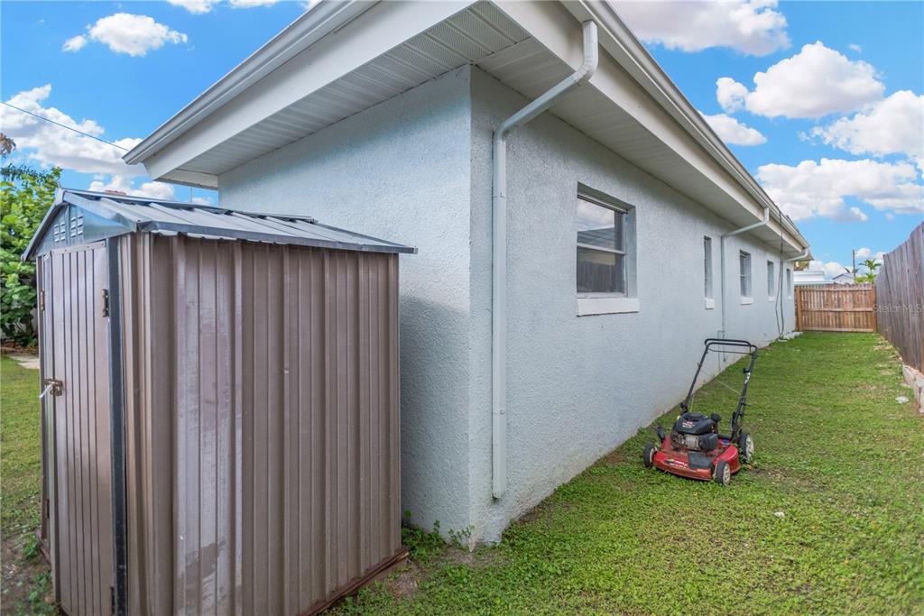 16214 3rd Street East Redington Beach, FL 33708 - Photo 28 of 30 a view of a backyard with potted plants