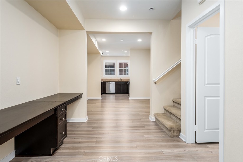 4956 Arrow Highway, Unit G Montclair, CA 91763 - Photo 11 of 32 a view of a kitchen cabinets and wooden floor