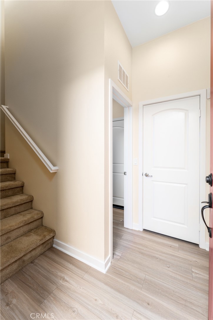 4956 Arrow Highway, Unit G Montclair, CA 91763 - Photo 6 of 32 a view of an empty room with wooden floor