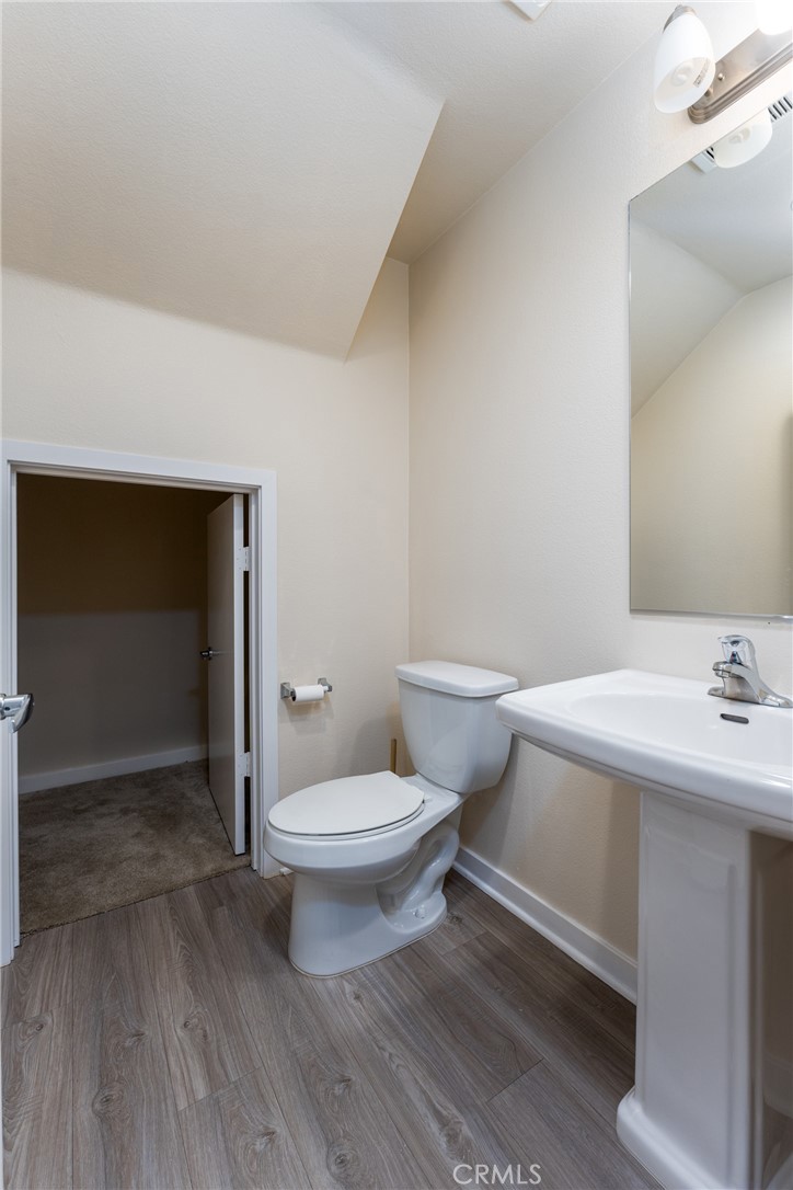 4956 Arrow Highway, Unit G Montclair, CA 91763 - Photo 7 of 32 a bathroom with a sink a toilet and shower