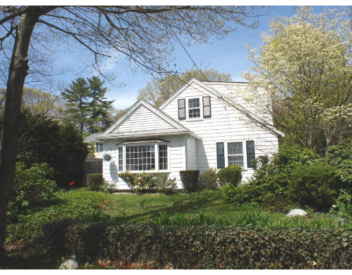 105 Spring Street Lexington, MA 02421 - Photo 1 of 18 a front view of a house with a yard and trees