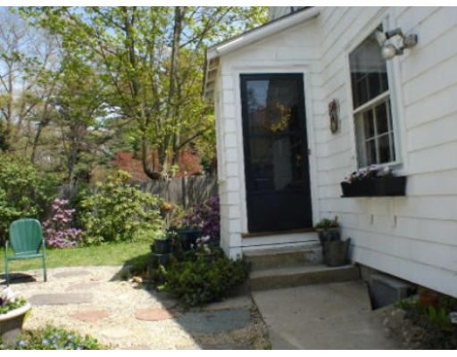 105 Spring Street Lexington, MA 02421 - Photo 17 of 18 a front view of a house with a yard