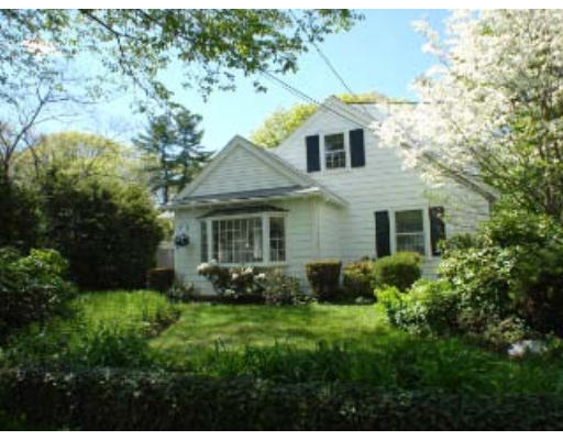105 Spring Street Lexington, MA 02421 - Photo 18 of 18 a front view of a house with garden