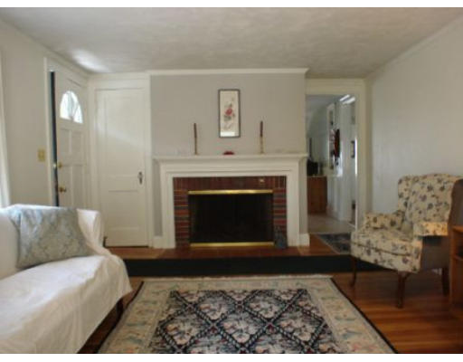 105 Spring Street Lexington, MA 02421 - Photo 3 of 18 a living room with furniture and a fireplace