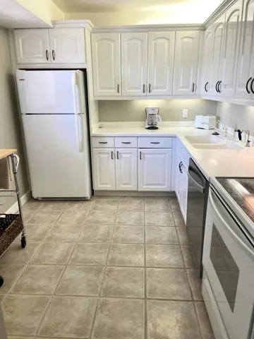a kitchen with a cabinets and a stove top oven