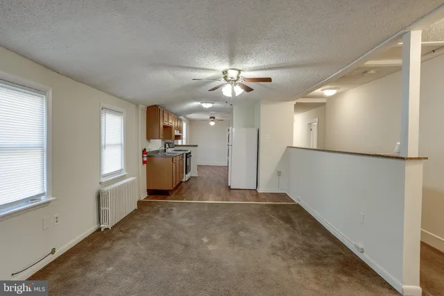 a view of a kitchen with a sink cabinets and a window