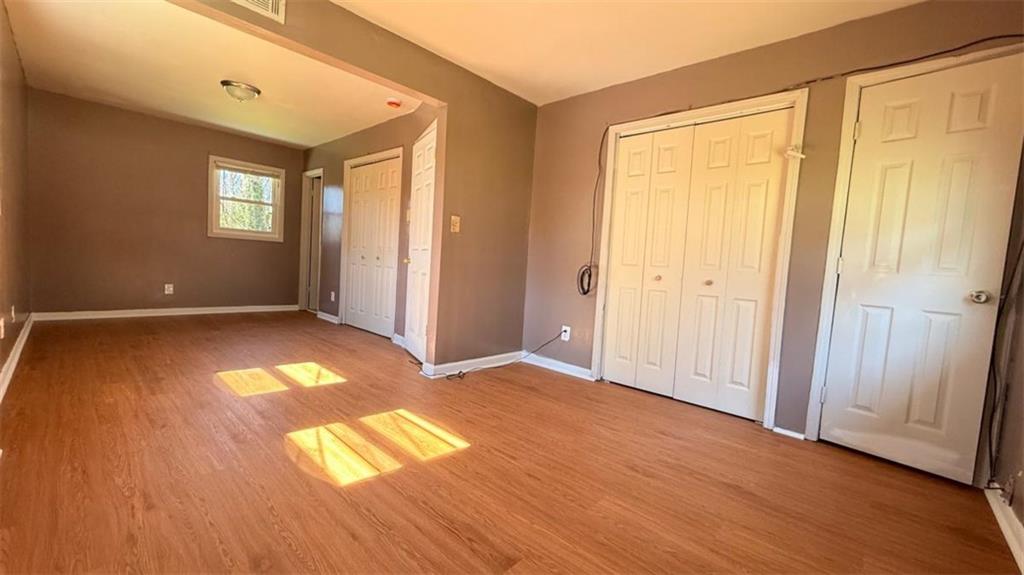 4183 O'Hara Road Forest Park, GA 30297 - Photo 13 of 24 a view of empty room with wooden floor and fan