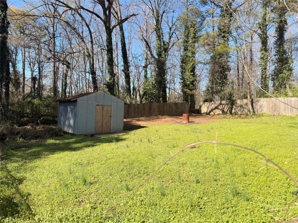 4183 O'Hara Road Forest Park, GA 30297 - Photo 24 of 24 a view of yard with swimming pool and trees
