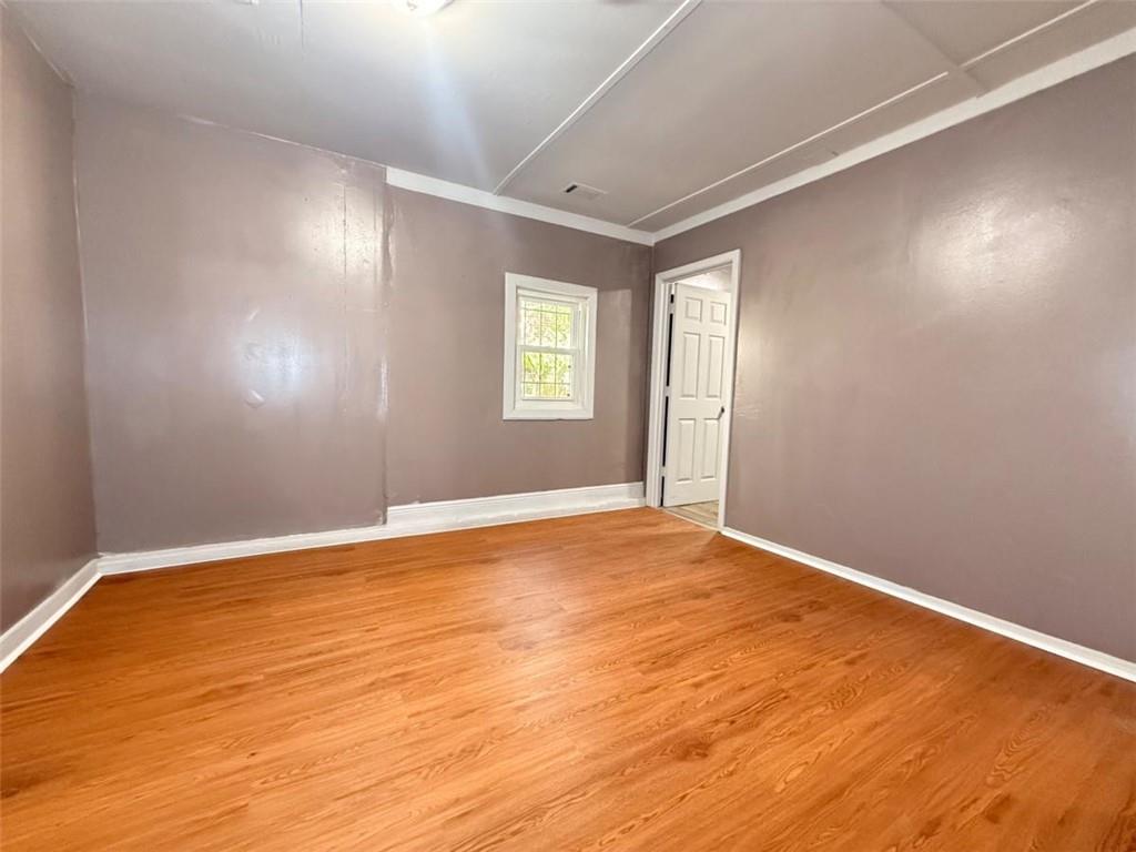 4183 O'Hara Road Forest Park, GA 30297 - Photo 8 of 24 a view of an empty room with wooden floor and a window