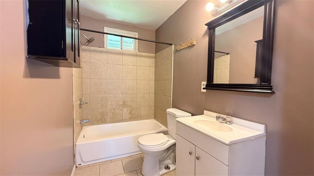 4183 O'Hara Road Forest Park, GA 30297 - Photo 10 of 24 a bathroom with a sink a toilet and shower