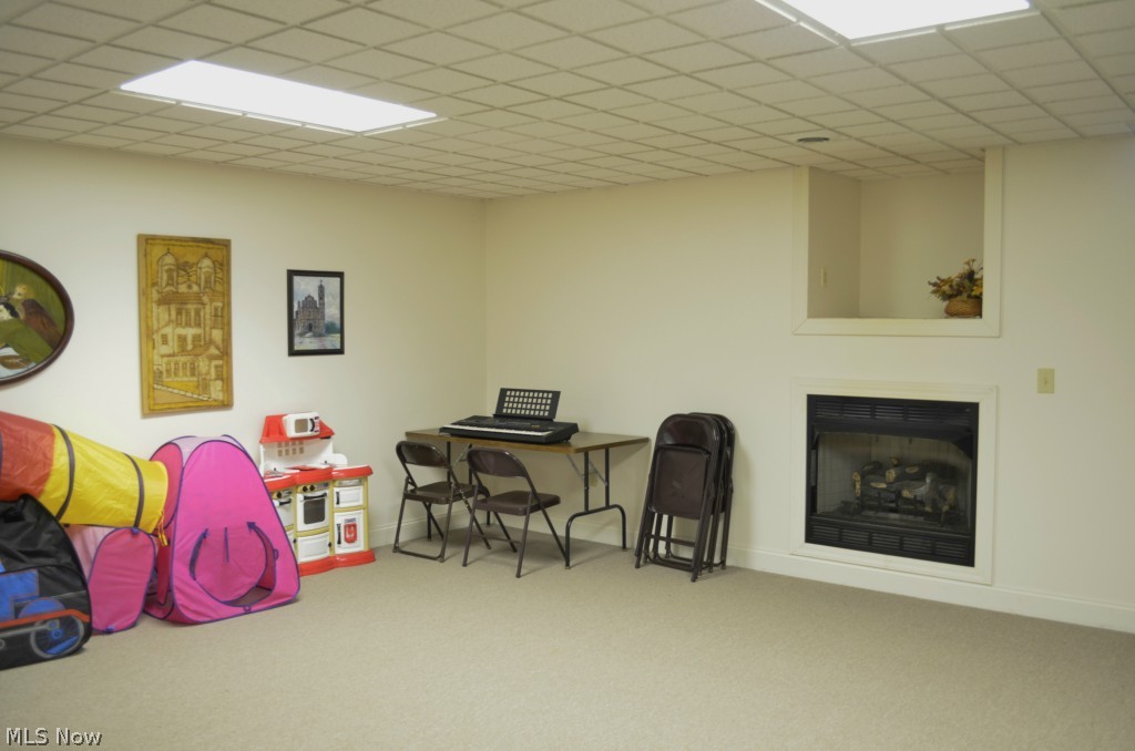 35780 Mills Road Avon, OH 44011 - Photo 16 of 24 Rec room with home's second fireplace
