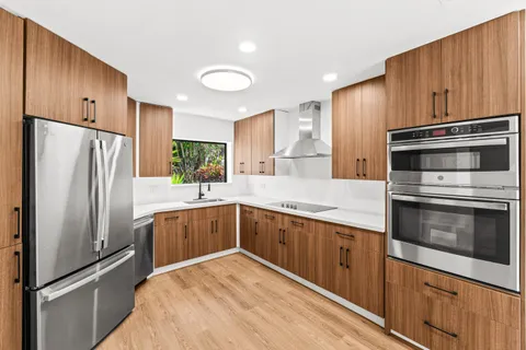 a kitchen with a refrigerator sink and microwave
