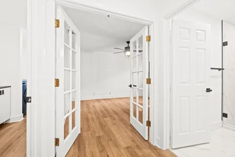 a view of a hallway with a white walls