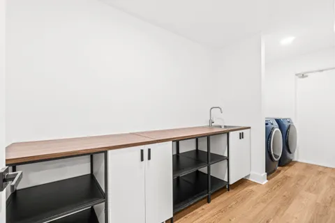 a bathroom with a shower toilet and sink