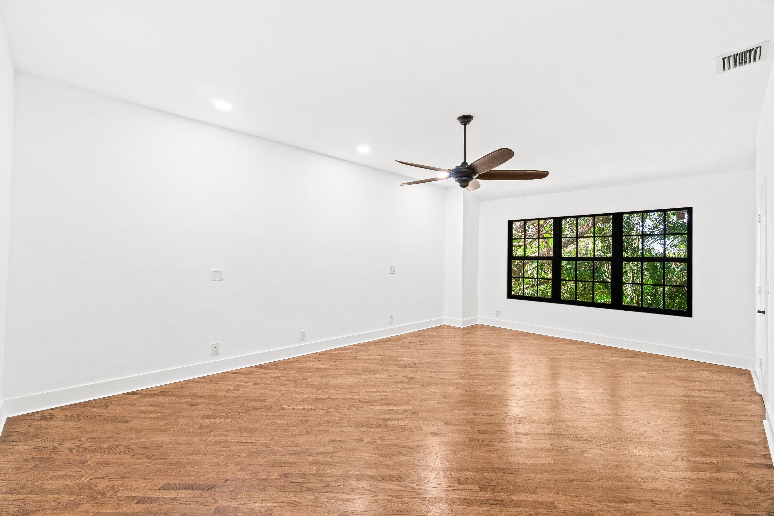 22548 Caravelle Circle, Unit 22548 Boca Raton, FL 33433 - Photo 31 of 40 a view of empty room with wooden floor and fan