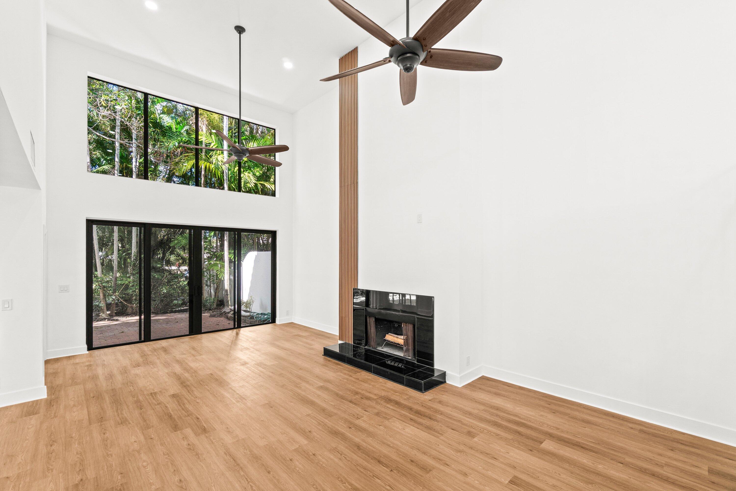 22548 Caravelle Circle, Unit 22548 Boca Raton, FL 33433 - Photo 8 of 40 a view of an empty room with a window and wooden floor