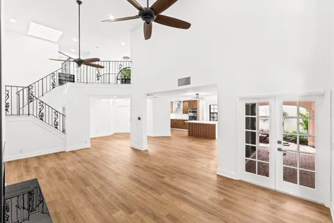 a view of a living room with wooden floor