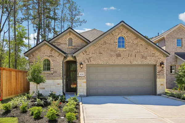 a front view of a house with garage