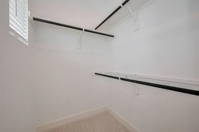 a bathroom with a granite countertop sink a toilet and bathtub