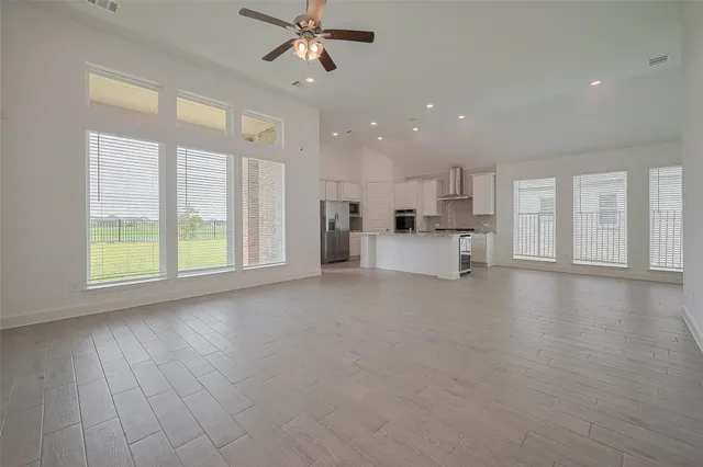 a view of a kitchen with a sink and a window