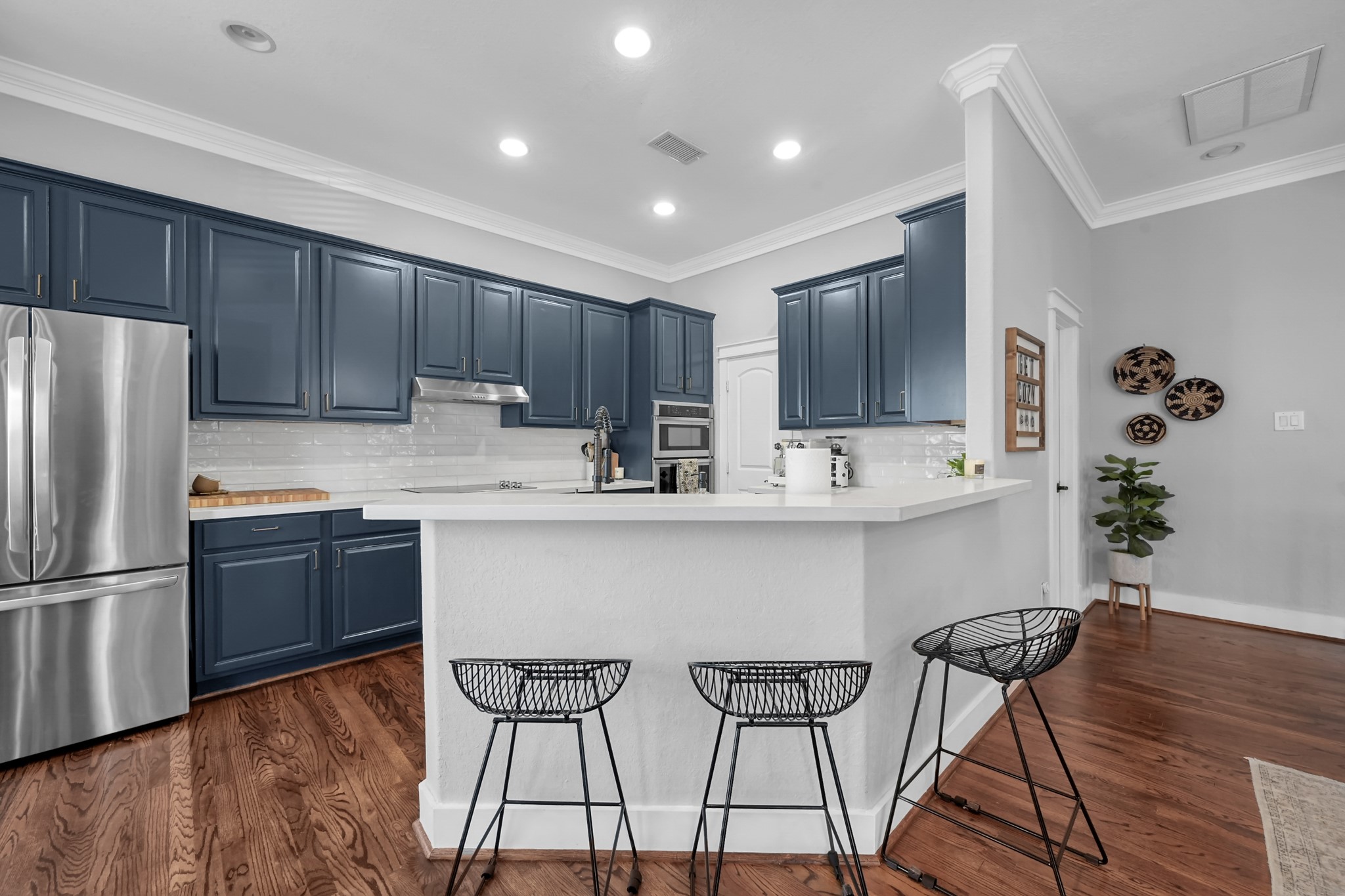 1328 West 23rd Street, Unit A Houston, TX 77008 - Photo 11 of 28 a kitchen with stainless steel appliances granite countertop a refrigerator sink and cabinets