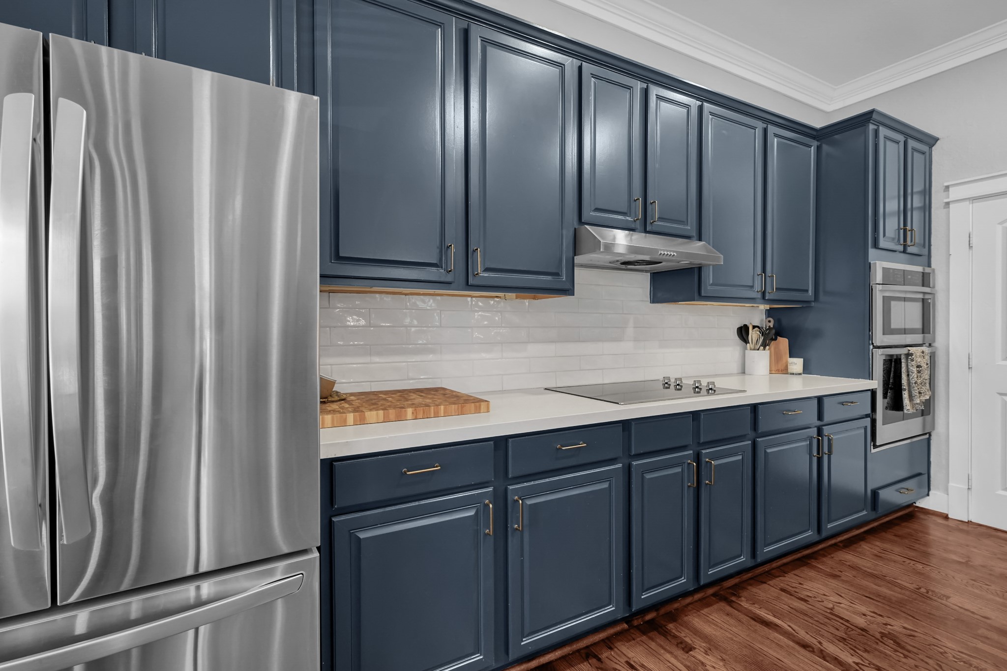 1328 West 23rd Street, Unit A Houston, TX 77008 - Photo 13 of 28 a kitchen with stainless steel appliances granite countertop a refrigerator and a sink
