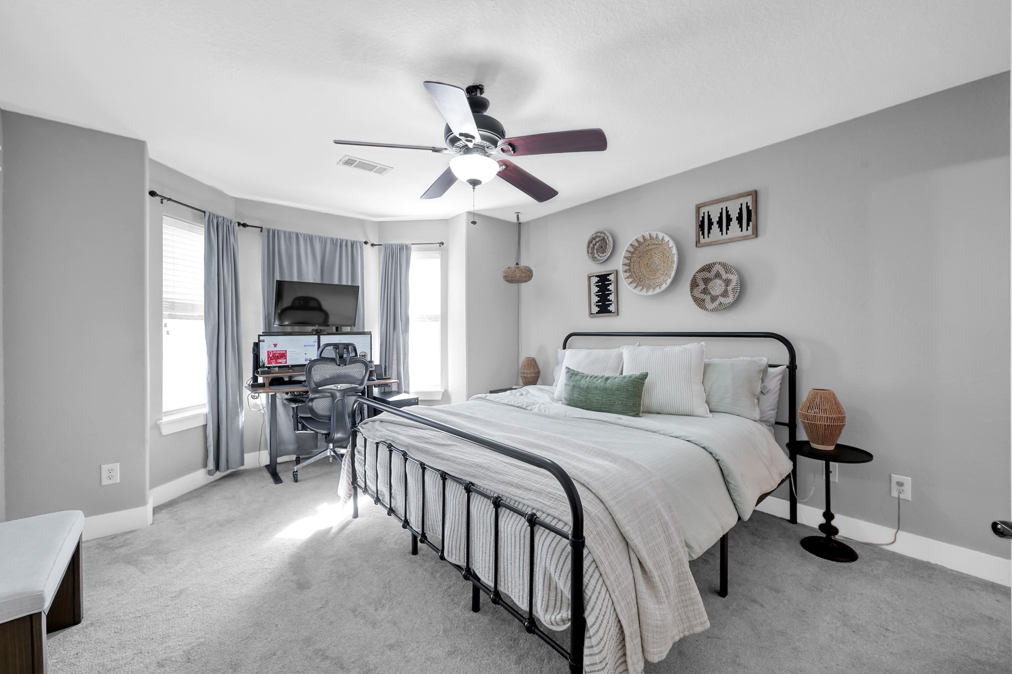 1328 West 23rd Street, Unit A Houston, TX 77008 - Photo 16 of 28 a bedroom with a bed and a chandelier