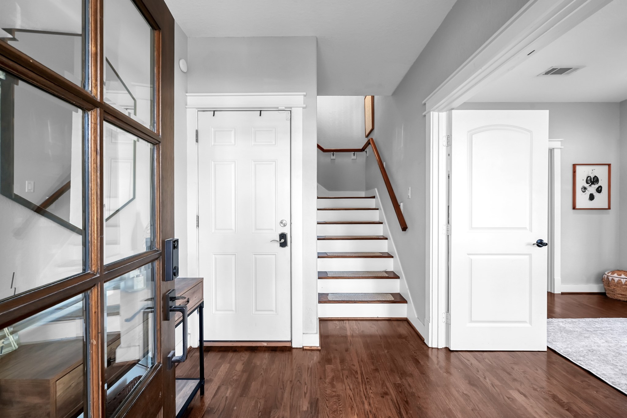 1328 West 23rd Street, Unit A Houston, TX 77008 - Photo 3 of 28 a view of an entryway with wooden floor and stairs