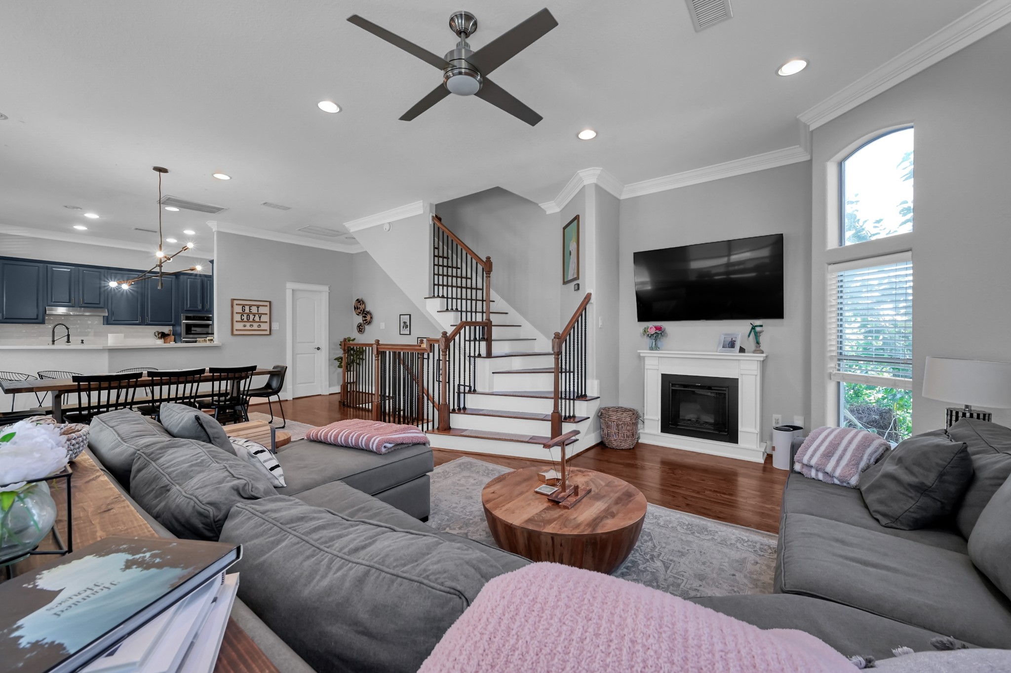 1328 West 23rd Street, Unit A Houston, TX 77008 - Photo 10 of 28 a living room with furniture a fireplace and a flat screen tv