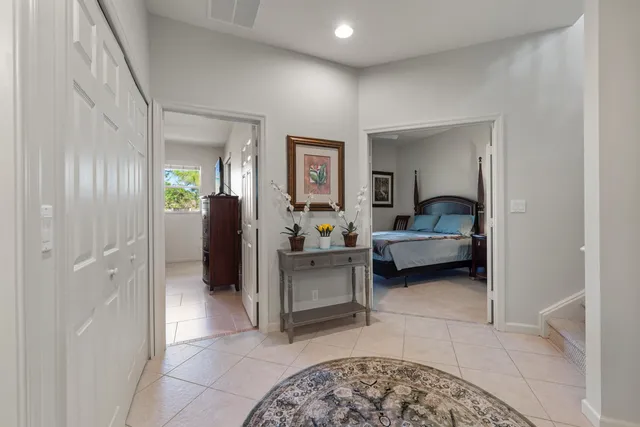 a living room with furniture and a bathroom